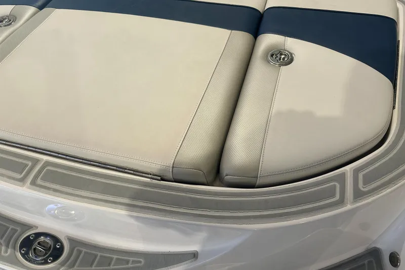 Slide: The Image of 2009 Nautique Super Air 210 boat seat with blue and white upholstery. - 33