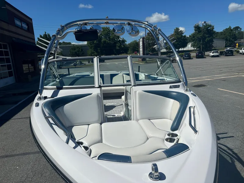 Slide: The Image of 2009 Nautique Super Air 210 boat with sleek seating and polished metal accents. - 7