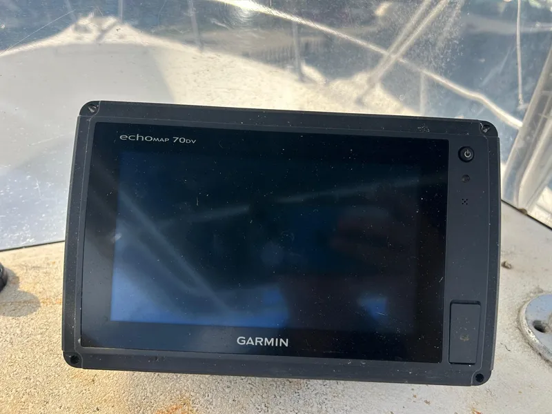 Slide: The Image of Garmin echoMAP 70dv on 1998 Cobia 224 CC boat dashboard. - 4