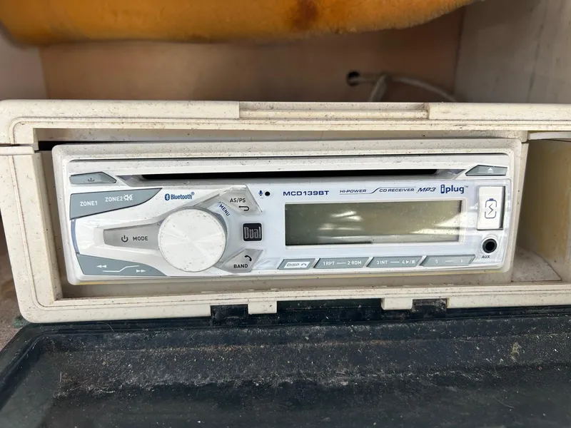 Slide: The Image of Boat stereo system in a 1998 Cobia 224 CC, featuring Bluetooth and MP3 capabilities. - 6