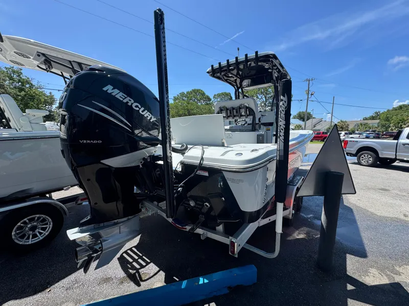 Slide: The Image of 2023 Blazer 2700 HYBRID BAY boat with Mercury Verado engine, parked outdoors. - 6