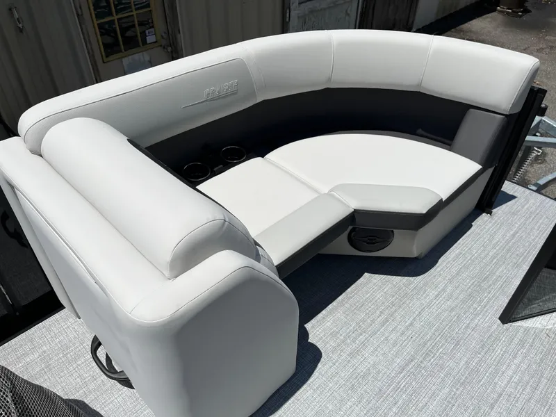 Slide: The Image of 2026 Harris Cruiser 210 boat interior with plush seating and modern dashboard. - 13