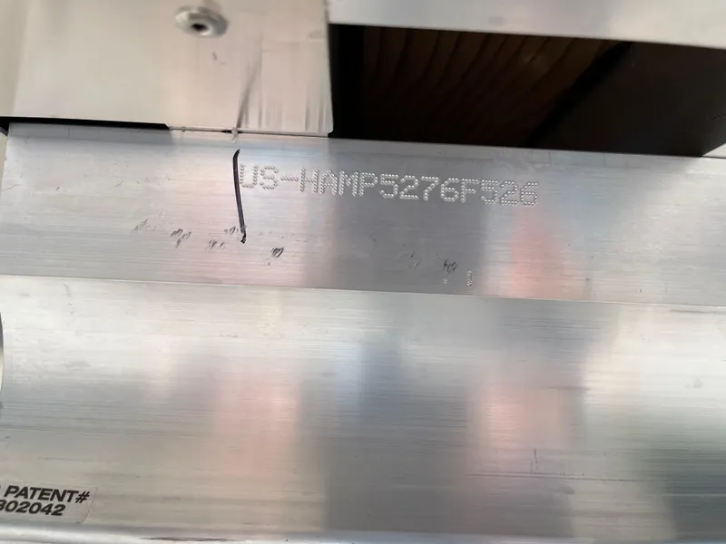 Slide: The Image of 2026 Harris Cruiser 210 boat interior with modern seating and steering console. - 21