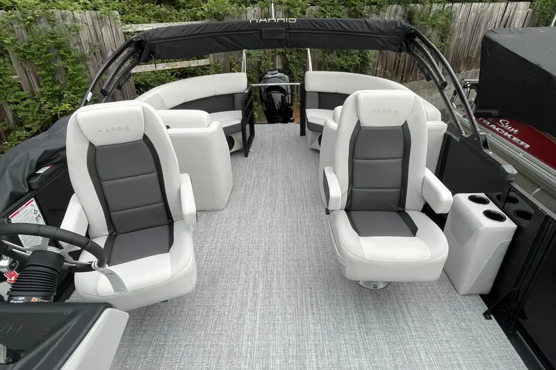 Slide: The Image of 2026 Harris Cruiser 210 boat interior with plush seating and modern design. - 27