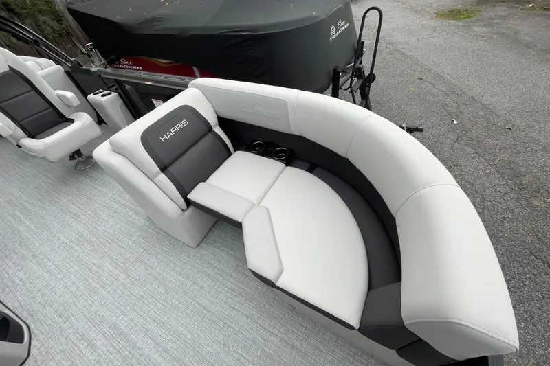 Slide: The Image of 2026 Harris Cruiser 210 boat interior with gray and black seating. - 30