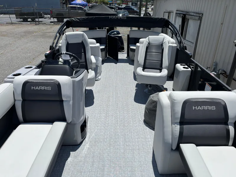 Slide: The Image of 2026 Harris Cruiser 210 boat interior with steering wheel and dashboard controls. - 8
