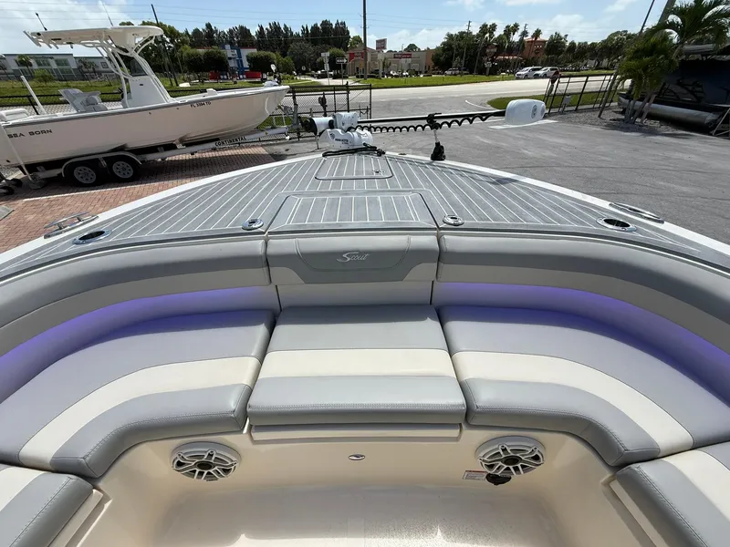 Slide: The Image of 2024 Scout 281 XSS boat interior with cushioned seating and modern design. - 31