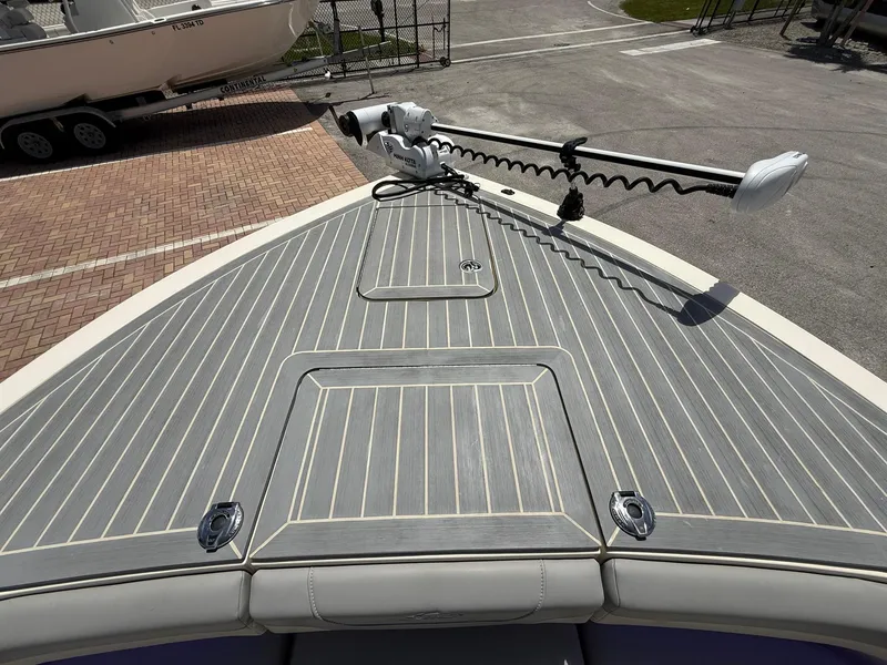 Slide: The Image of 2024 Scout 281 XSS boat deck with mounted trolling motor, showcasing sleek design. - 32