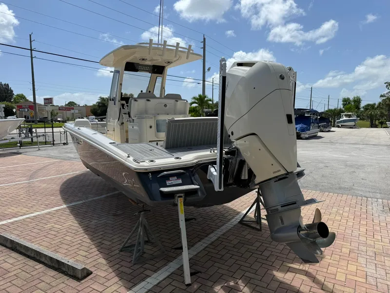 Slide: The Image of 2024 Scout 281 XSS boat on display, featuring a powerful outboard motor. - 4