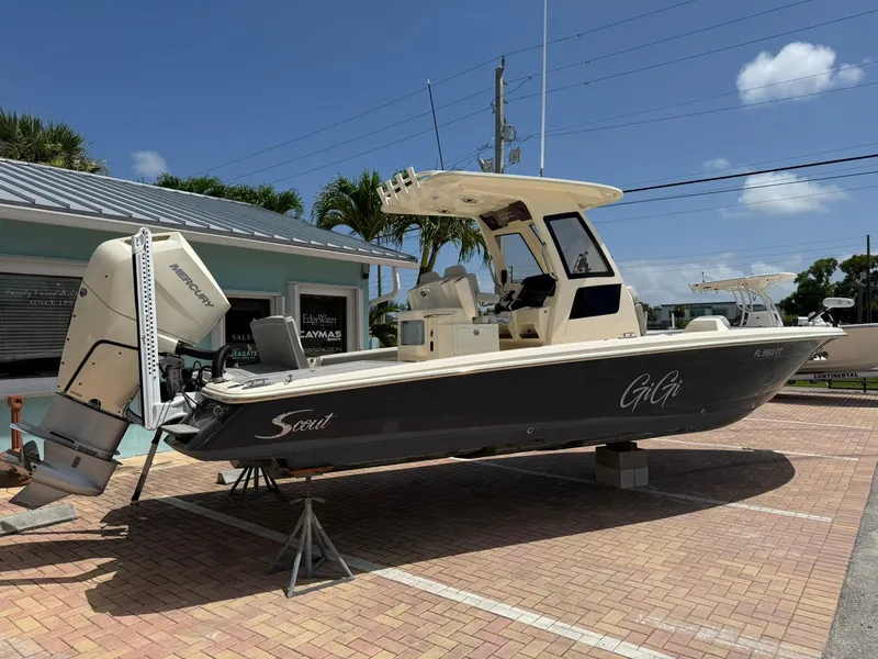 Slide: The Image of 2024 Scout 281 XSS boat displayed outdoors on a sunny day. - 6