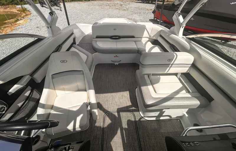 Slide: The Image of 2018 Cobalt CS23 boat interior with white seating and modern design. - 12
