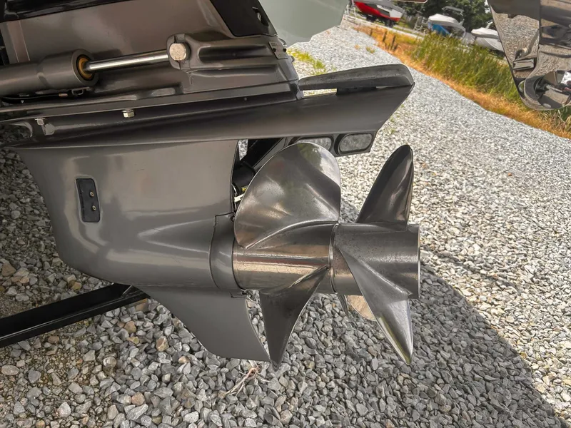 Slide: The Image of 2018 Cobalt CS23 boat propeller on gravel surface. - 18