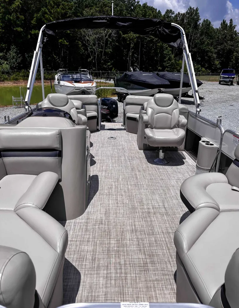 Slide: The Image of 2018 South Bay 200 Series S222RS 25 pontoon boat with spacious seating and canopy. - 13