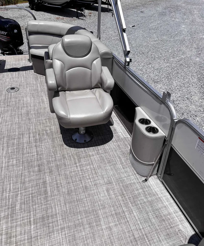 Slide: The Image of 2018 South Bay 200 Series S222RS 25 pontoon boat interior with seating and cup holders. - 14