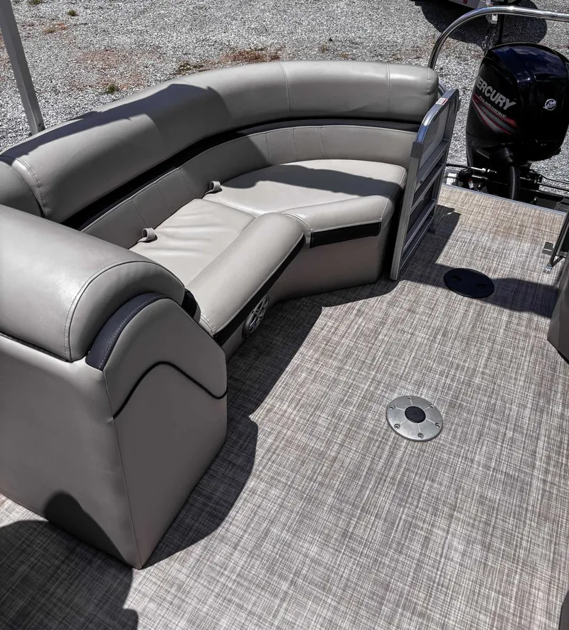 Slide: The Image of 2018 South Bay 200 Series S222RS 25 pontoon boat interior with gray seating and Mercury engine. - 18