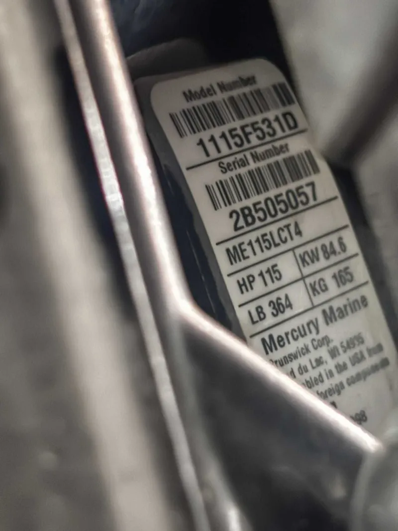 Slide: The Image of Close-up of Mercury Marine engine label with model and serial numbers. - 21