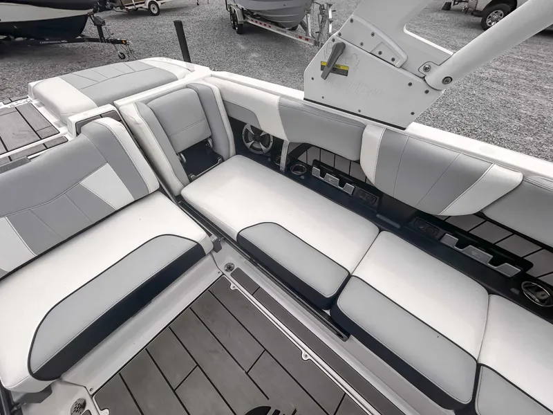 Slide: The Image of 2020 Malibu 23 MXZ boat interior with gray and white seating, showcasing modern design. - 18