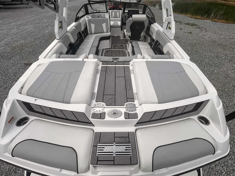 Slide: The Image of 2020 Malibu 23 MXZ boat interior with spacious seating and modern design. - 9