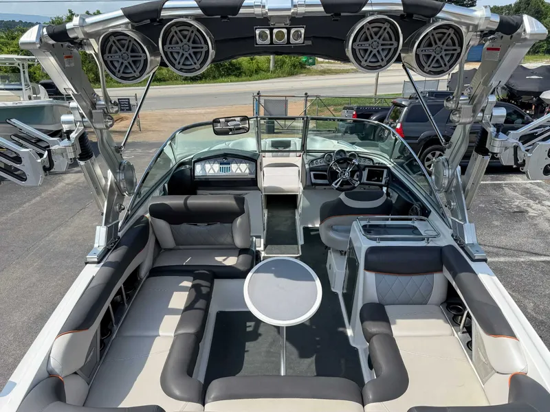 Slide: The Image of 2012 MasterCraft X55 boat interior with luxury seating and advanced audio system. - 10