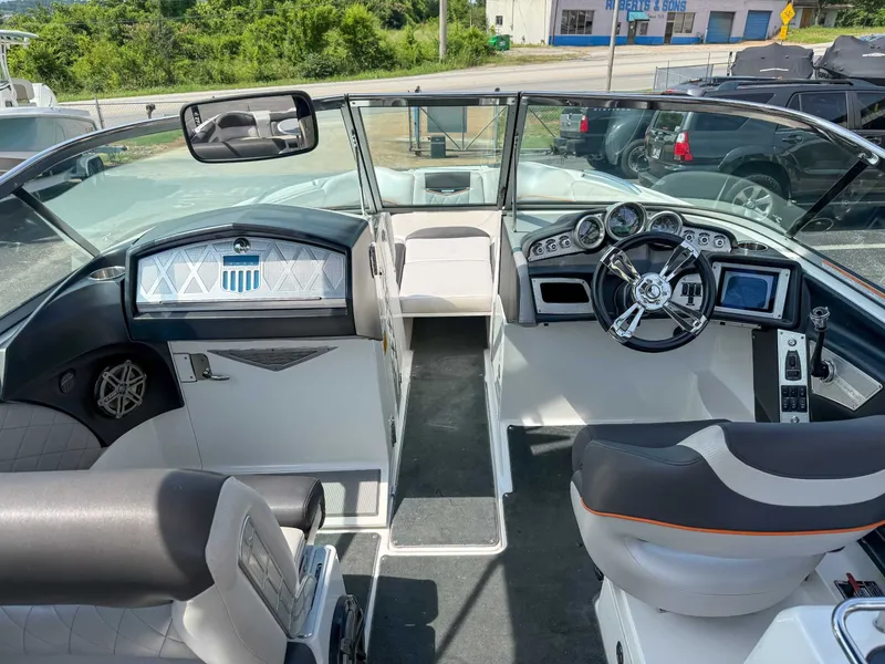 Slide: The Image of 2012 MasterCraft X55 boat interior with modern dashboard and steering wheel. - 11