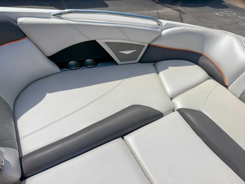 Slide: The Image of 2012 MasterCraft X55 boat interior with sleek, modern seating and stylish design. - 13