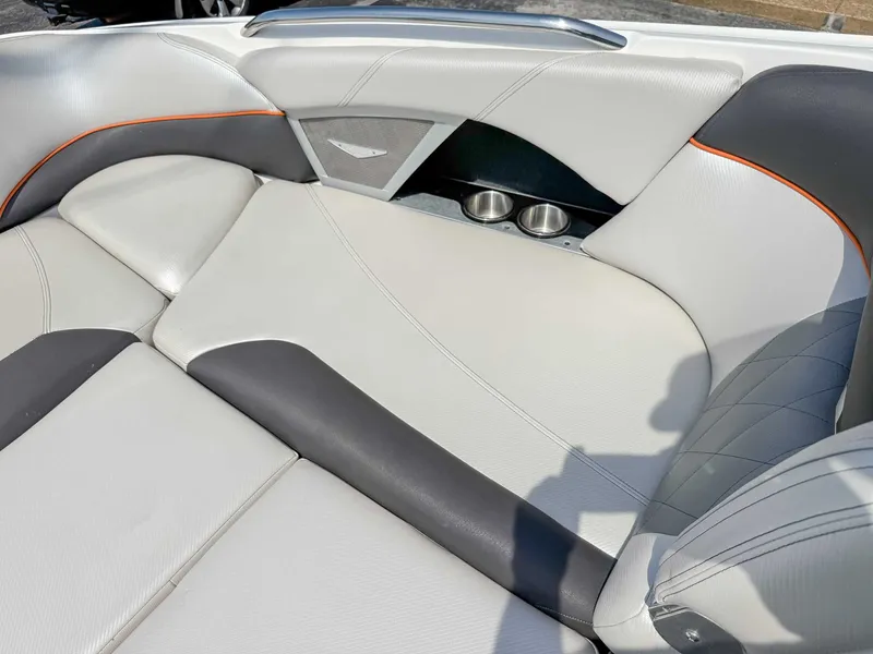 Slide: The Image of Luxurious seating in a 2012 MasterCraft X55 boat with cup holders and stylish upholstery. - 14