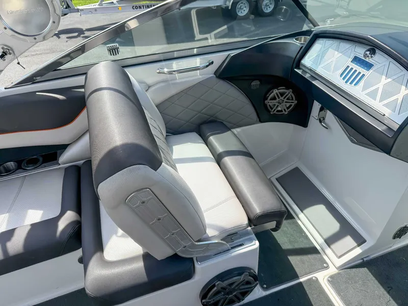 Slide: The Image of Interior of a 2012 MasterCraft X55 boat, featuring sleek seating and modern dashboard design. - 15