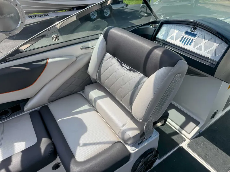 Slide: The Image of 2012 MasterCraft X55 boat interior with luxurious seating and modern dashboard design. - 16
