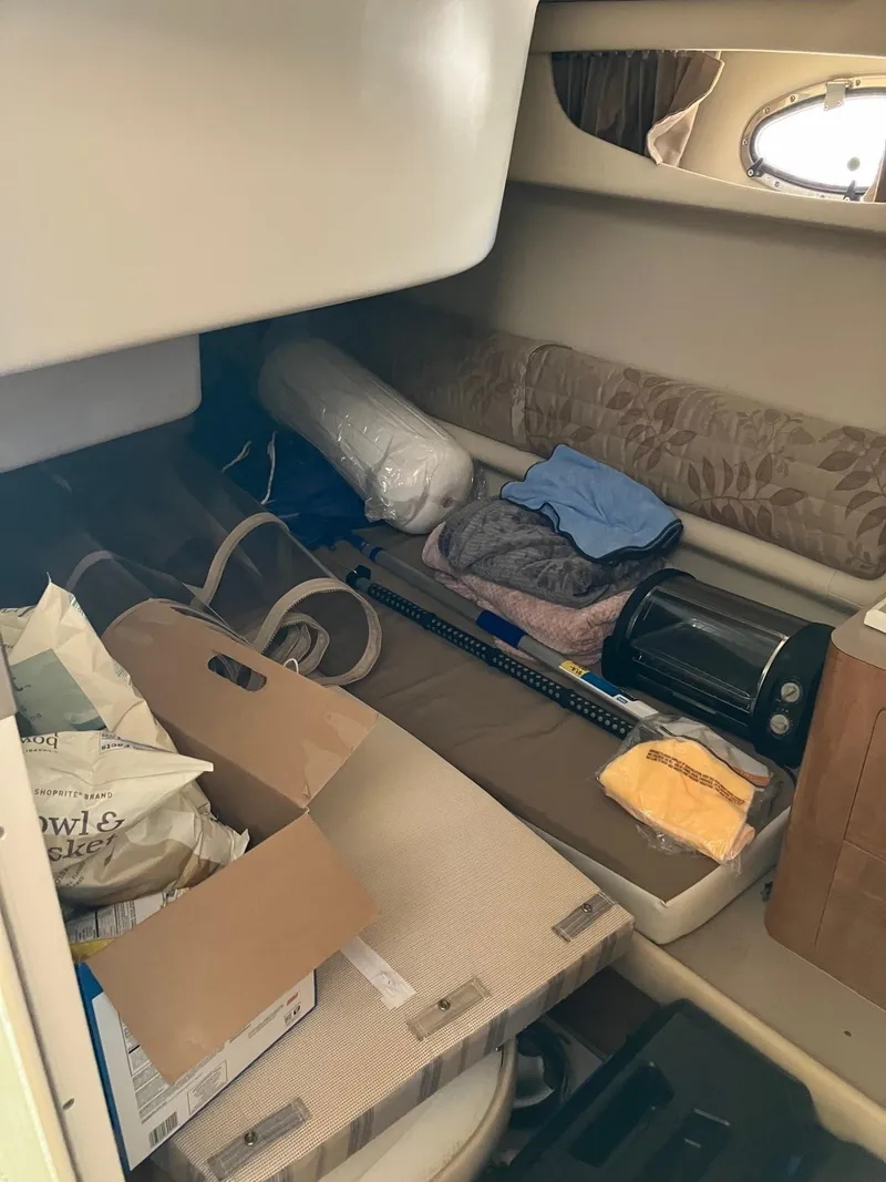 Slide: The Image of Interior cabin of 2002 Regal Commodore 3880 with storage items and seating area. - 14