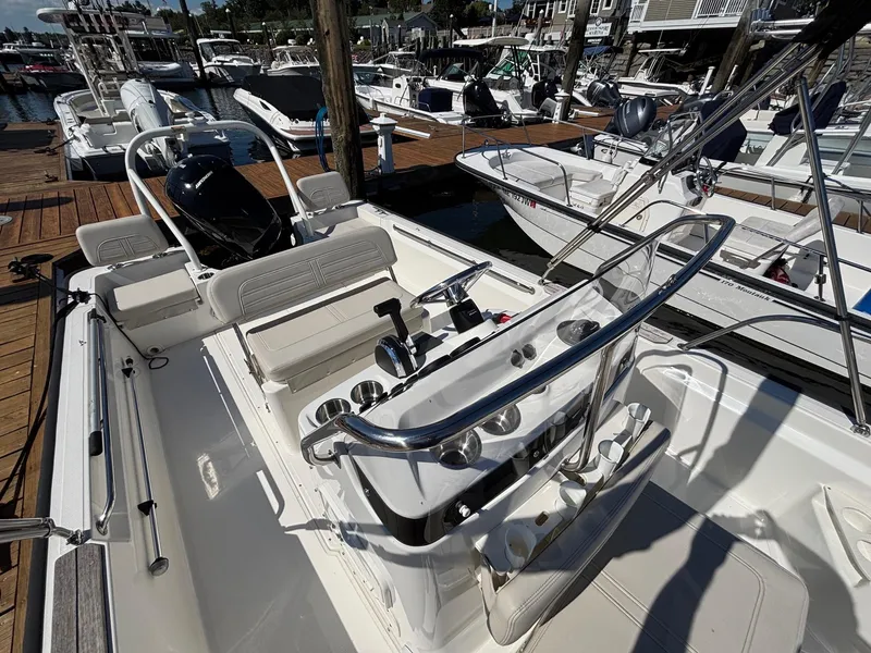 Slide: The Image of 2023 Boston Whaler 190 Montauk boat docked, showcasing sleek design and modern features. - 10