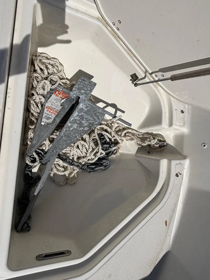 Slide: The Image of Anchor and rope storage in 2023 Boston Whaler 190 Montauk boat compartment. - 7