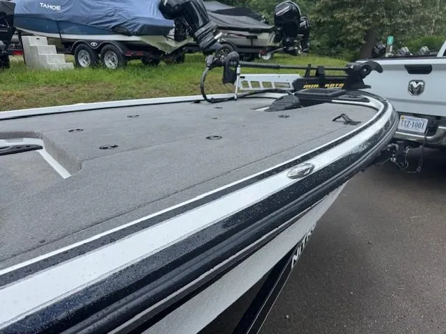 Slide: The Image of 2016 Nitro Z18 boat on trailer, parked outdoors near a truck. - 4