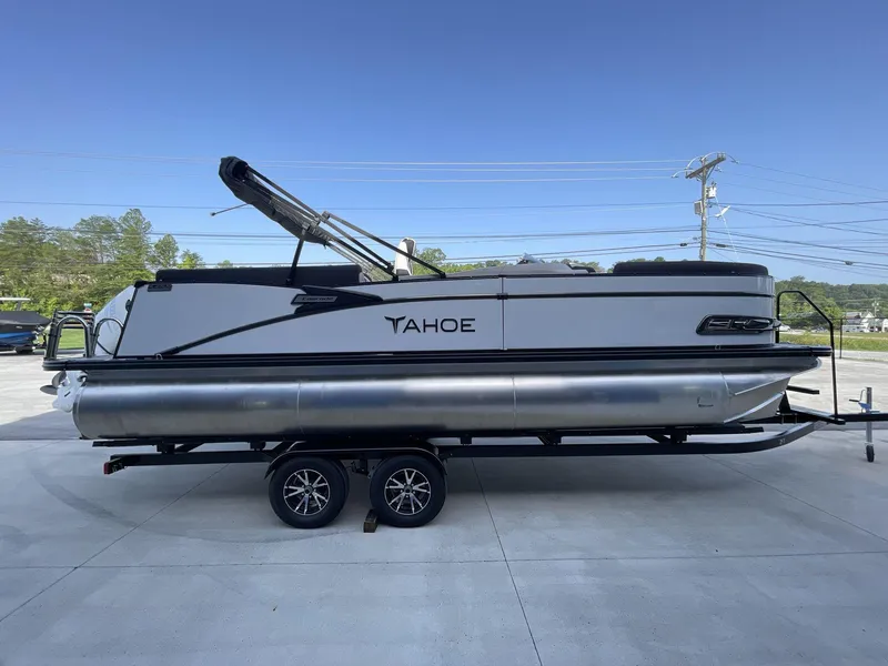Slide: The Image of 2024 Tahoe Pontoon 23 Cascade Versatile Rear Lounger on trailer, side view. - 10