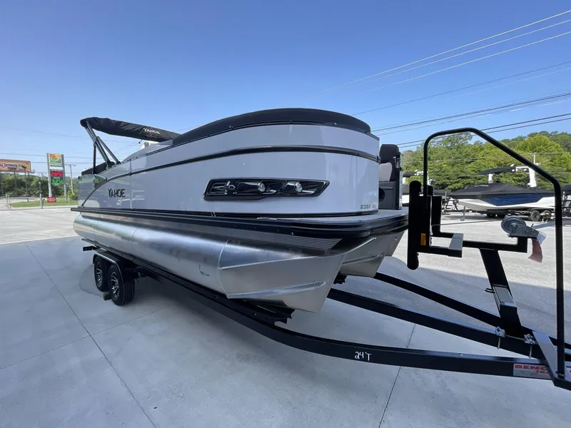 Slide: The Image of 2024 Tahoe Pontoon 23 Cascade Versatile Rear Lounger on trailer, outdoor display. - 11