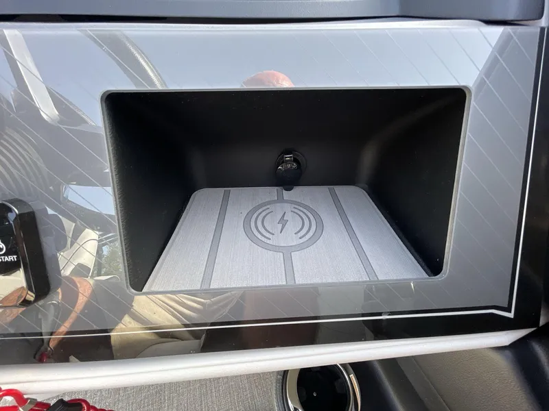 Slide: The Image of 2024 Tahoe Pontoon 23 Cascade Versatile Rear Lounger dashboard with wireless charging pad. - 22
