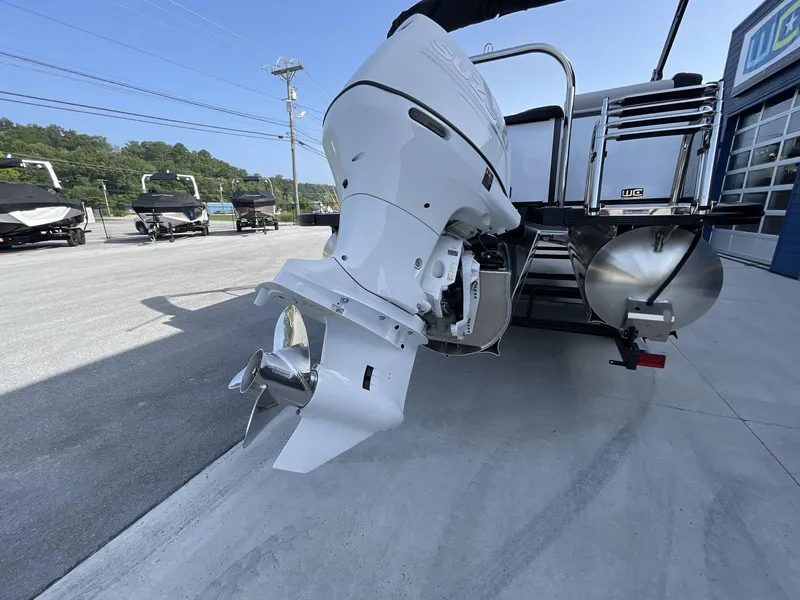 Slide: The Image of 2024 Tahoe Pontoon 23 Cascade Versatile Rear Lounger with powerful outboard motor. - 8