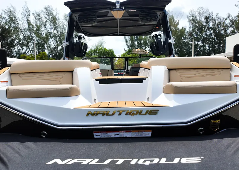 Slide: The Image of 2025 Nautique G23 boat with beige seating and sleek design. - 10