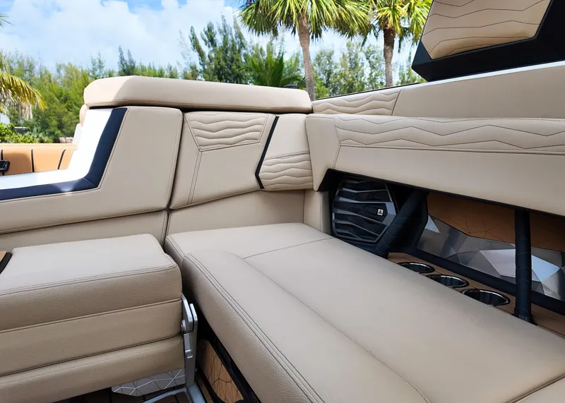 Slide: The Image of Luxurious interior of 2025 Nautique G23 boat with beige seating and modern design. - 14