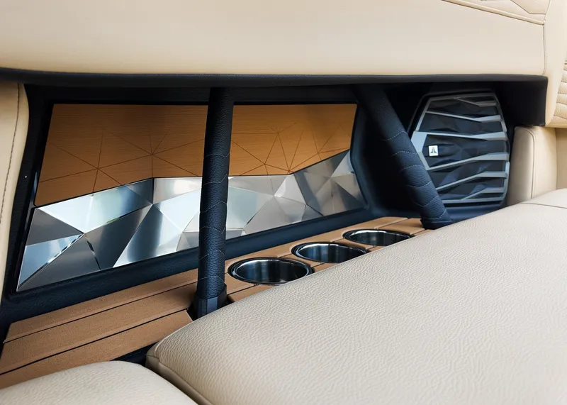 Slide: The Image of 2025 Nautique G23 interior detail with cup holders and modern design elements. - 8