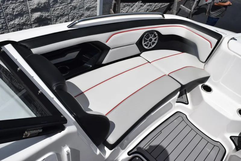 Slide: The Image of 2018 Yamaha Boats 212X interior seating with sleek design and modern upholstery. - 14