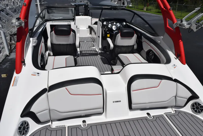 Slide: The Image of 2018 Yamaha Boats 212X interior with sleek seating and modern dashboard design. - 5
