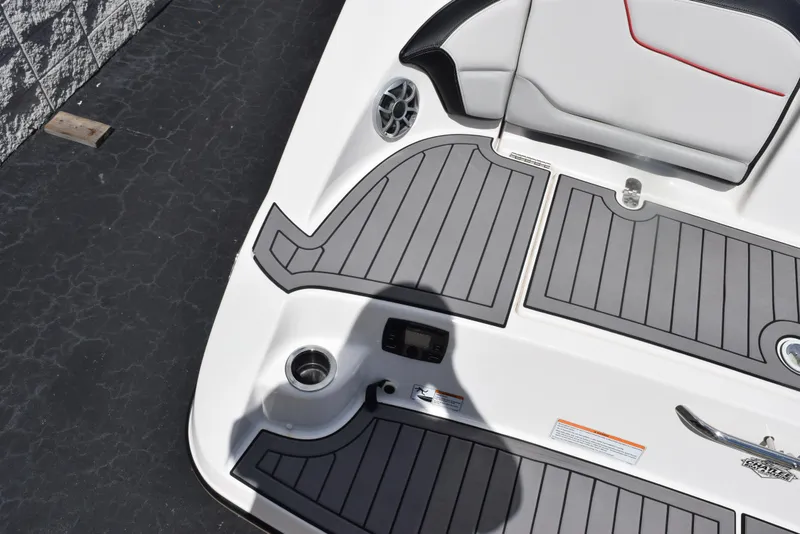 Slide: The Image of 2018 Yamaha Boats 212X deck with gray non-slip flooring and seating. - 8