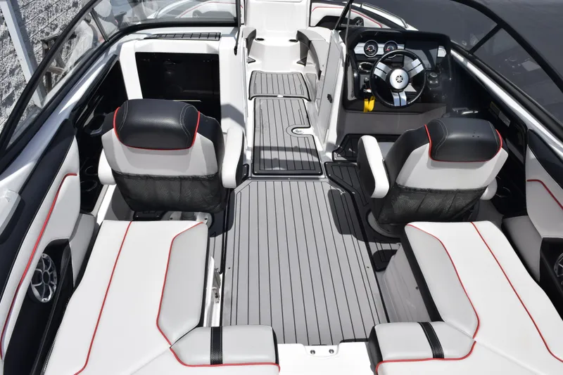 Slide: The Image of 2018 Yamaha Boats 212X interior with sleek seating and modern dashboard design. - 9