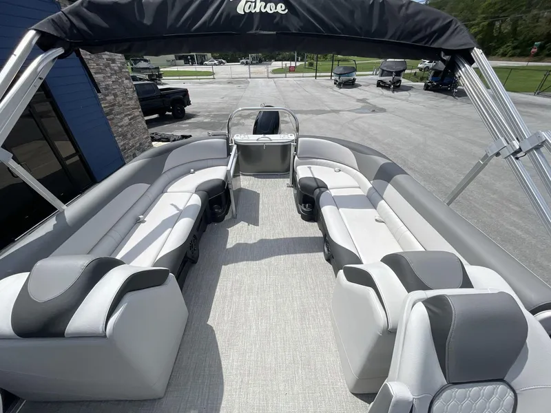 Slide: The Image of 2024 Tahoe Pontoon 25 LSZ QL interior with spacious seating and modern design. - 13