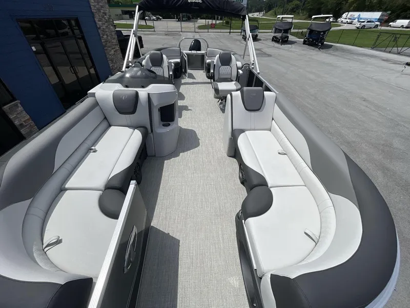 Slide: The Image of 2024 Tahoe Pontoon 25 LSZ QL interior with spacious seating and modern design. - 17
