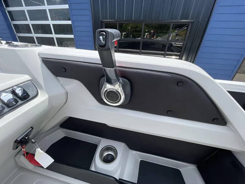 Slide: The Image of 2024 Tahoe Pontoon 25 LSZ QL boat throttle control with Suzuki branding. - 20