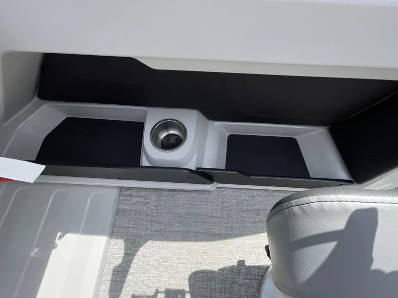 Slide: The Image of Interior of 2024 Tahoe Pontoon 25 LSZ QL featuring a cup holder and seating area. - 23