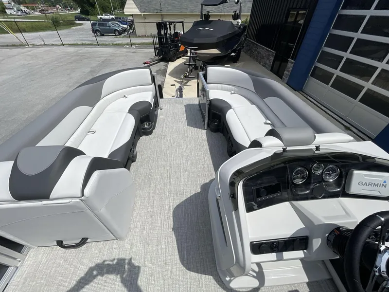 Slide: The Image of 2024 Tahoe Pontoon 25 LSZ QL interior with plush seating and modern dashboard. - 24