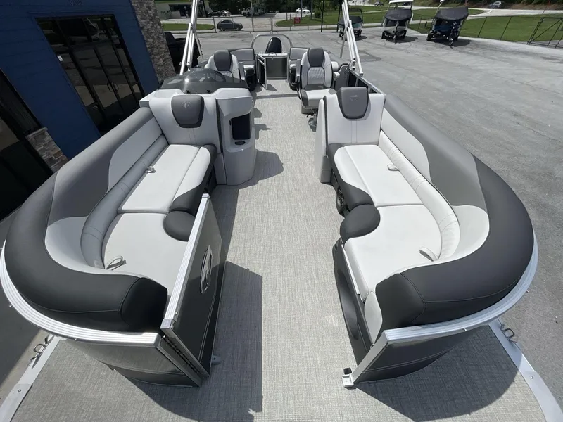 Slide: The Image of 2024 Tahoe Pontoon 25 LSZ QL with spacious seating and modern design. - 26