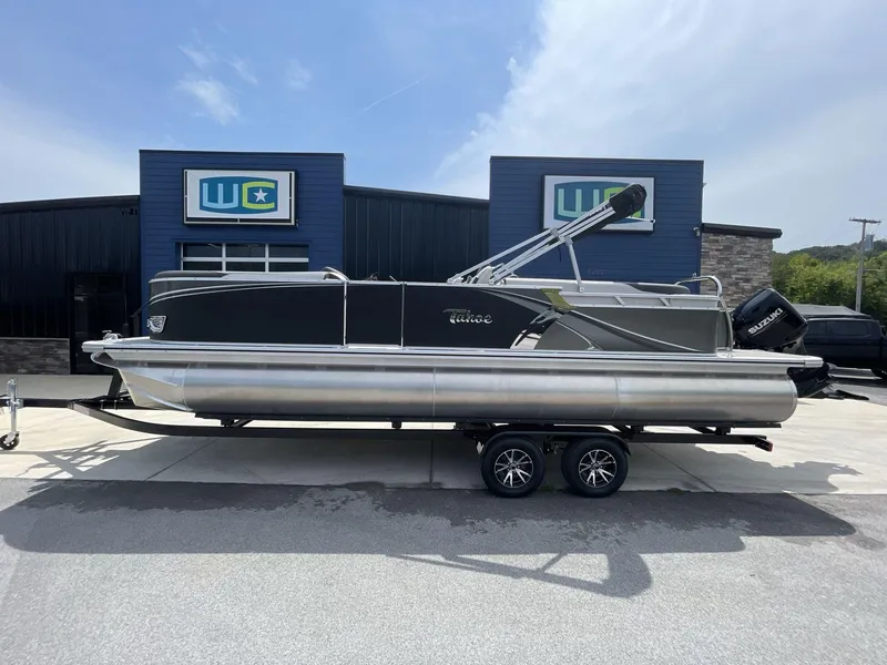 Slide: The Image of 2024 Tahoe Pontoon 25 LSZ QL boat on trailer, parked outside dealership. - 4